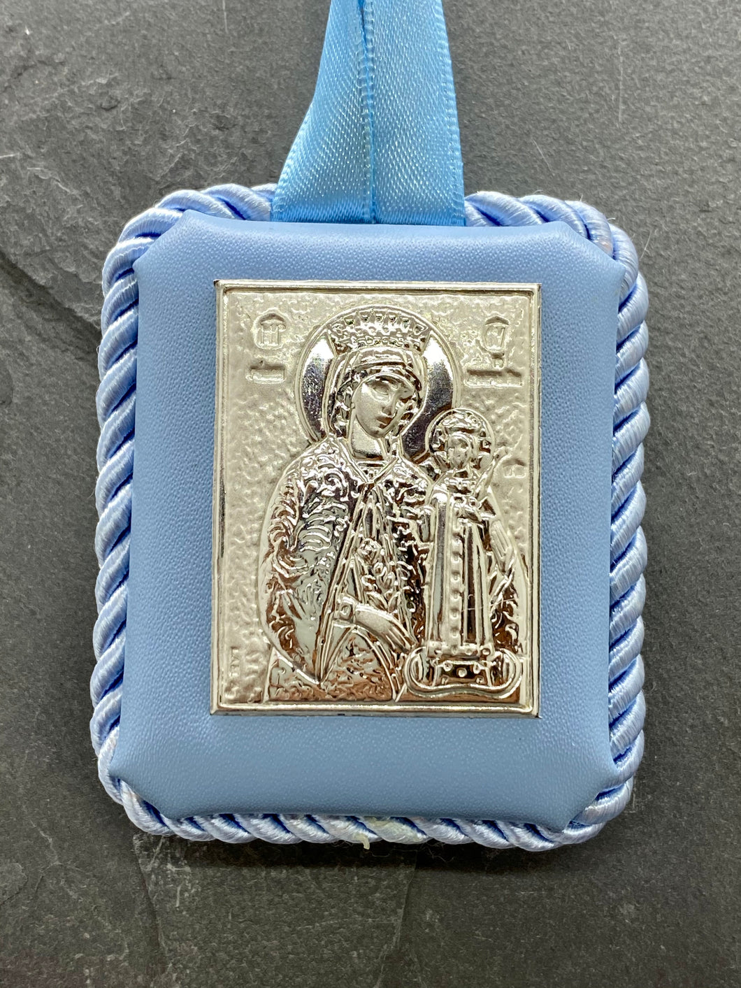 Silver Panagia Icon on Blue Leather Pillow Trimmed with Cord PS61